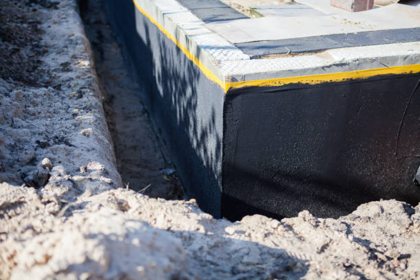 Professional Waterproofing technician working in Akron, OH
